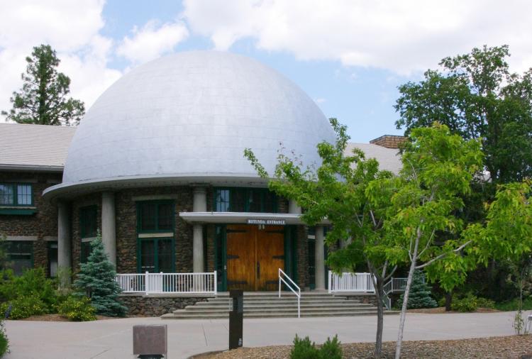 The Lowell Observatory rotunda during the day. The dome of the rotunda is white.
