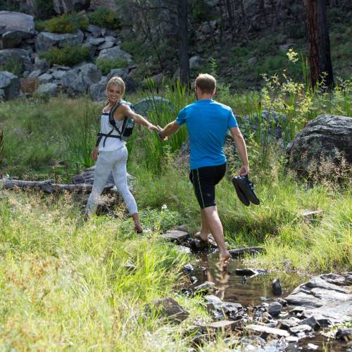 Couple hiking in the woods in Flagstaff