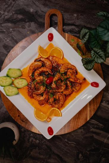 Shrimp on a white plate with Mexican seasonings from Mi Tesoro Modern Mexican