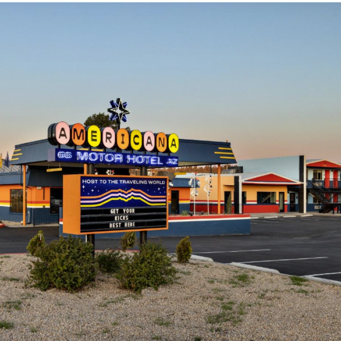 The Americana Motor Hotel sign with colorful typography.