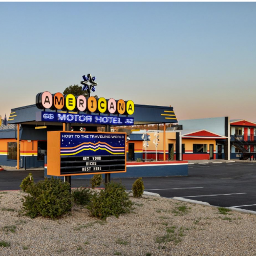 The Americana Motor Hotel sign with colorful typography.
