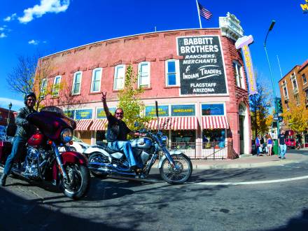 two bikers riding through downtown flagstaff