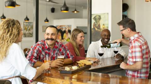 couples sitting at restaurant bar