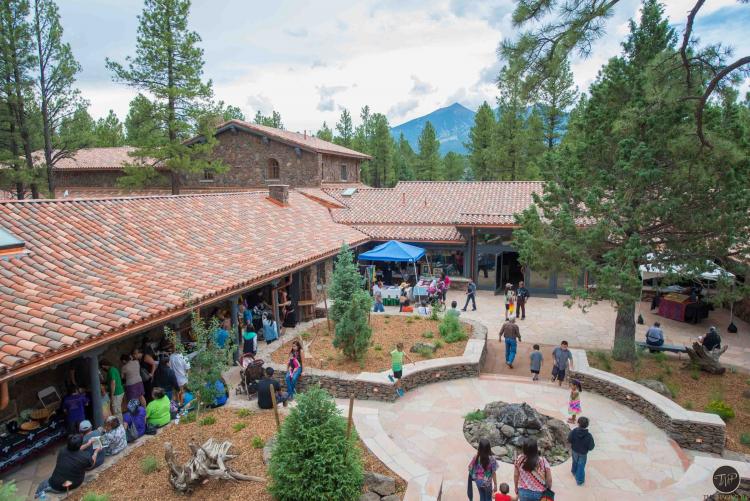 Visitors walk around the outside of the Museum of Northern Arizona