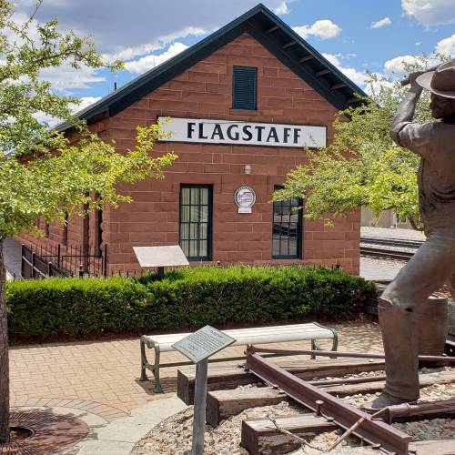 One stop on the Route 66 Walk This Talk tour features the old train station and a statue