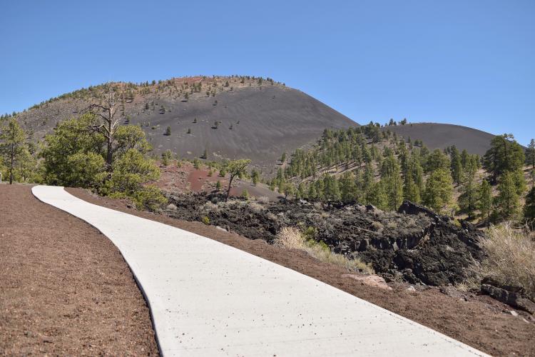 A paved trail winds through Sunset Crater Volcano National Monument