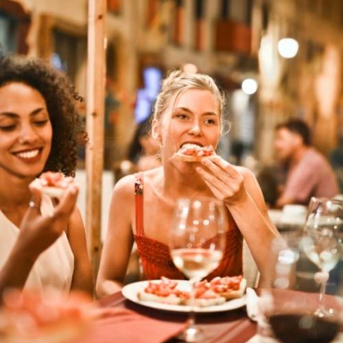 Women enjoying dinner and wine together in Flagstaff, AZ
