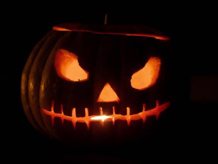 close-up of a glowing jack-o-lantern in the dark