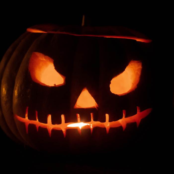 close-up of a glowing jack-o-lantern in the dark